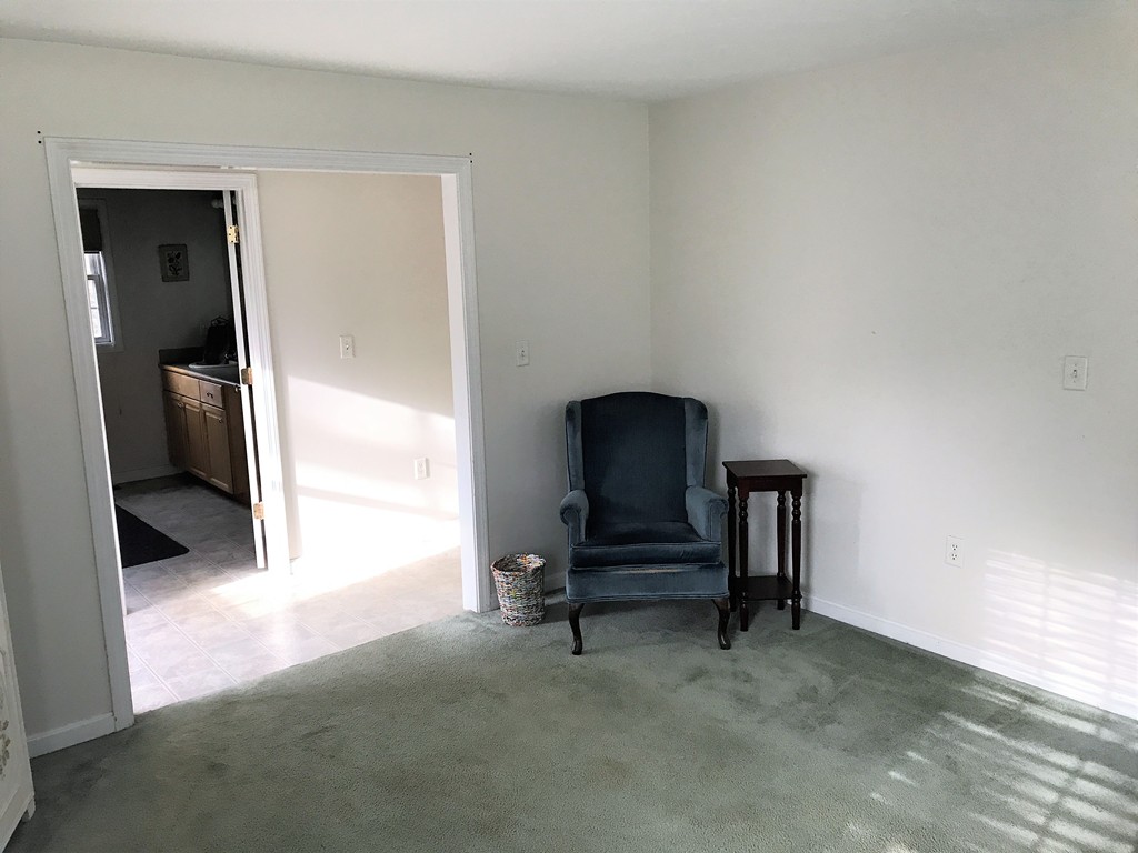 380 Richardson Road Dracut, MA 01826 - Photo 15 of 21 a living room with furniture and a painting on the wall