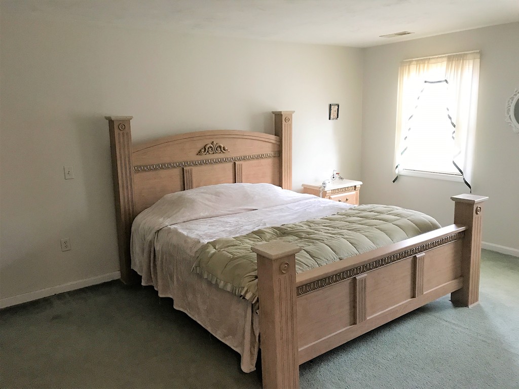 380 Richardson Road Dracut, MA 01826 - Photo 19 of 21 a bedroom with a bed and window