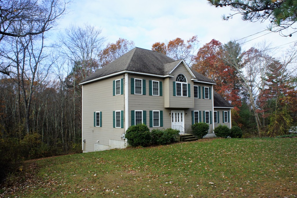 380 Richardson Road Dracut, MA 01826 - Photo 2 of 21 a front view of a house with a garden