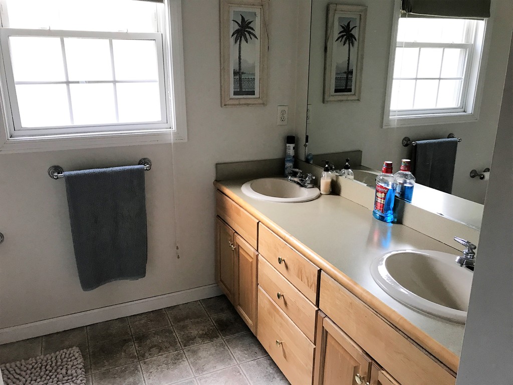 380 Richardson Road Dracut, MA 01826 - Photo 21 of 21 a bathroom with double sink and two mirror