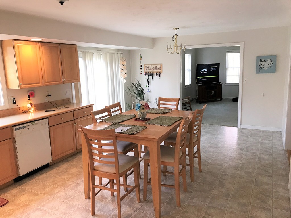 380 Richardson Road Dracut, MA 01826 - Photo 5 of 21 a view of a dining room and livingroom with furniture window