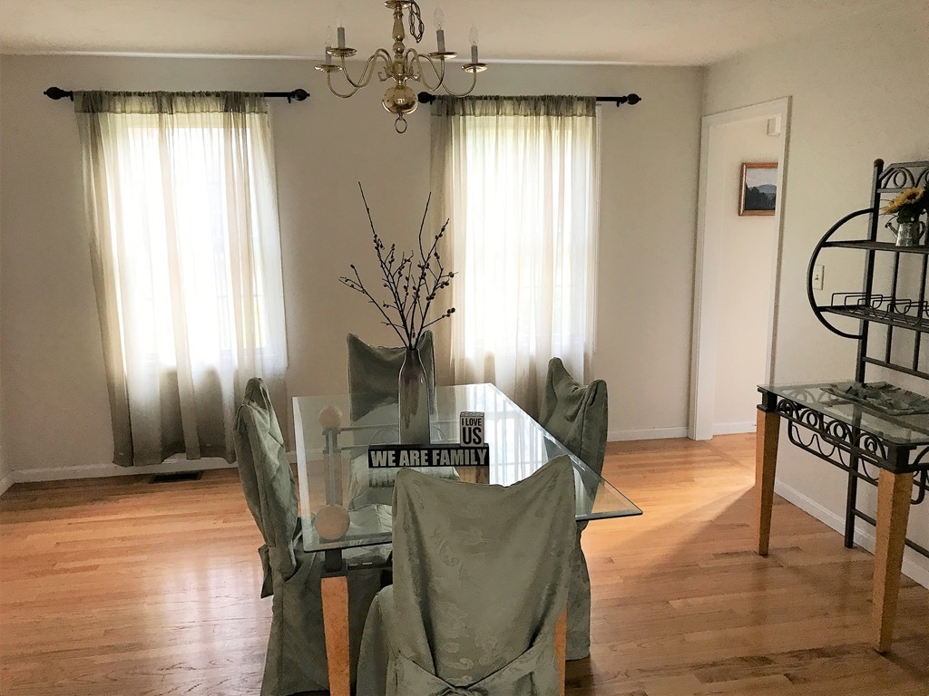 380 Richardson Road Dracut, MA 01826 - Photo 7 of 21 a living room with furniture and a window