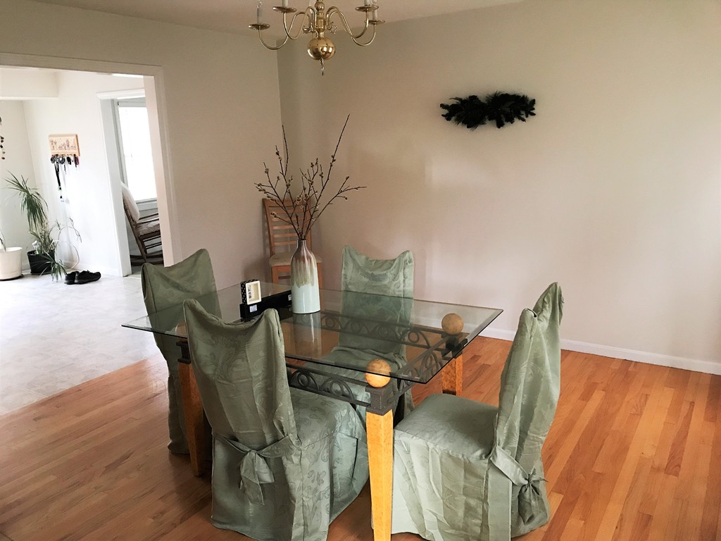 380 Richardson Road Dracut, MA 01826 - Photo 8 of 21 a view of a living room with furniture and wooden floor