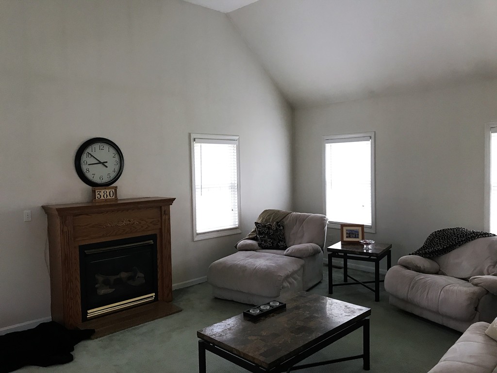 380 Richardson Road Dracut, MA 01826 - Photo 10 of 21 a living room with furniture and a fireplace