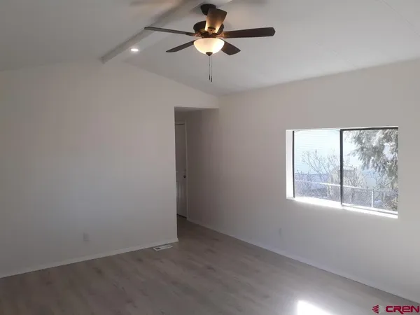 a view of an empty room with a window