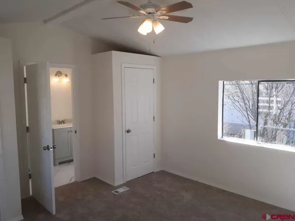 a view of an empty room with a window