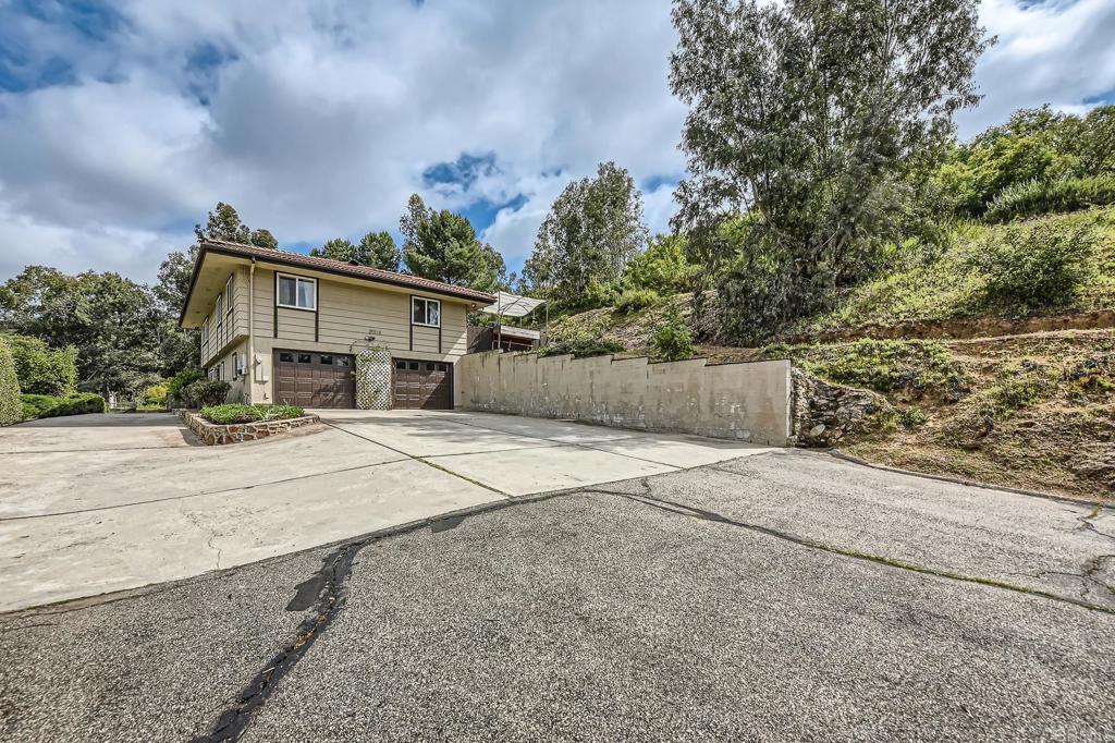 29515 Lilac Road Valley Center, CA 92082 - Photo 1 of 1 front view of a house with a yard and a garage
