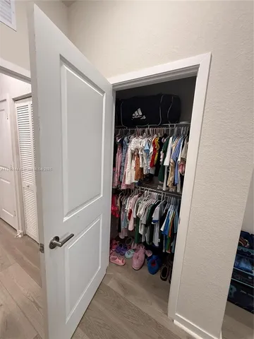 a view of a closet with storage