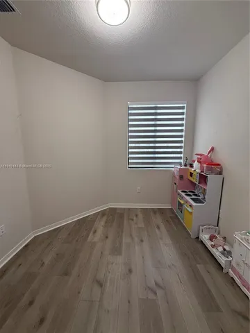 a room with toys and wooden floor