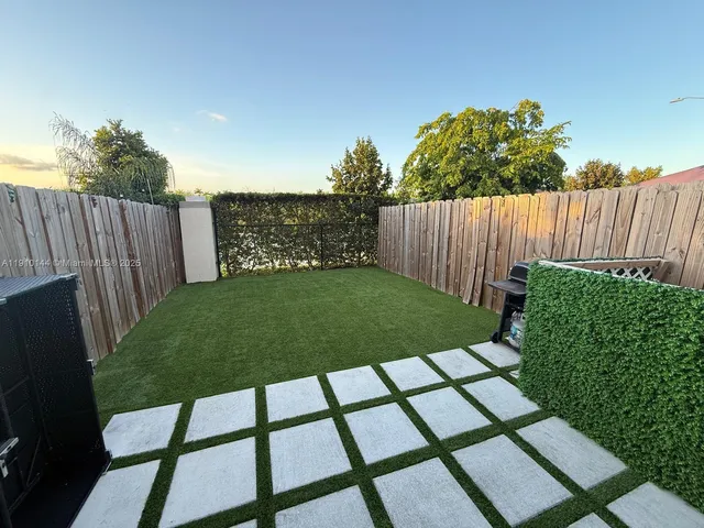 a view of a backyard with garden