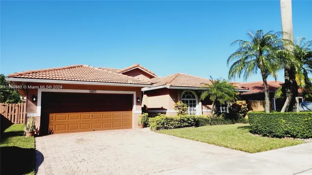 a front view of a house with garage
