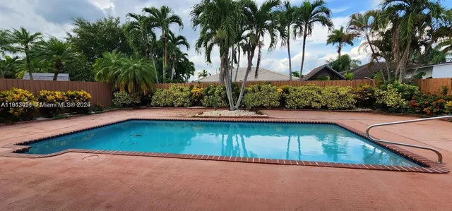 a view of a backyard with a patio