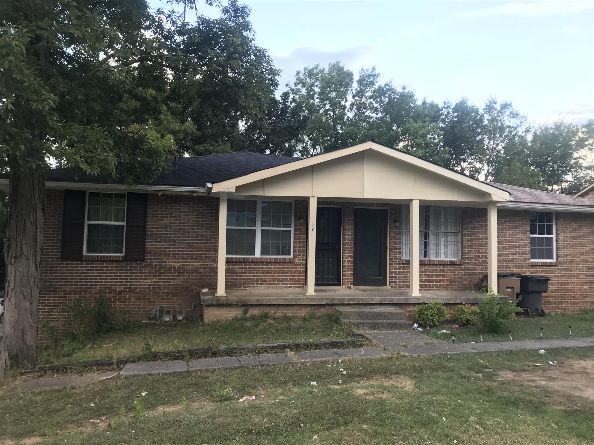 2907 Anderson Road Nashville, TN 37217 - Photo 1 of 12 a front view of a house with a yard