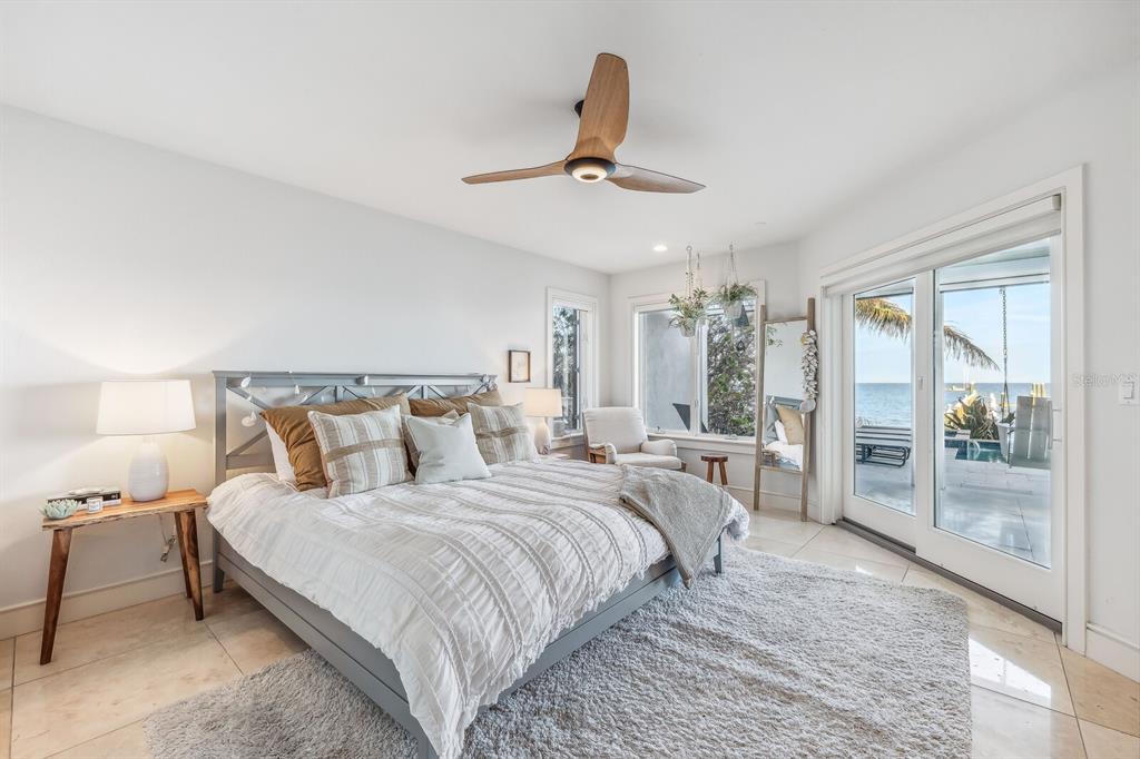 1644 Treasure Lane Boca Grande, FL 33921 - Photo 23 of 42 a bedroom with bed and large window
