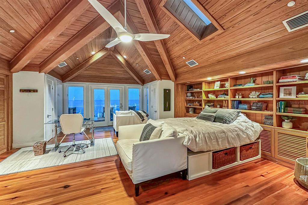 1644 Treasure Lane Boca Grande, FL 33921 - Photo 27 of 42 a bed room with a bed and a chair