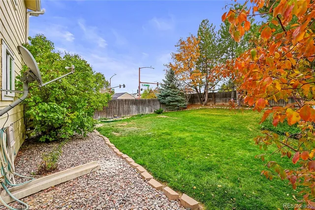 a backyard of a house with lots of green space