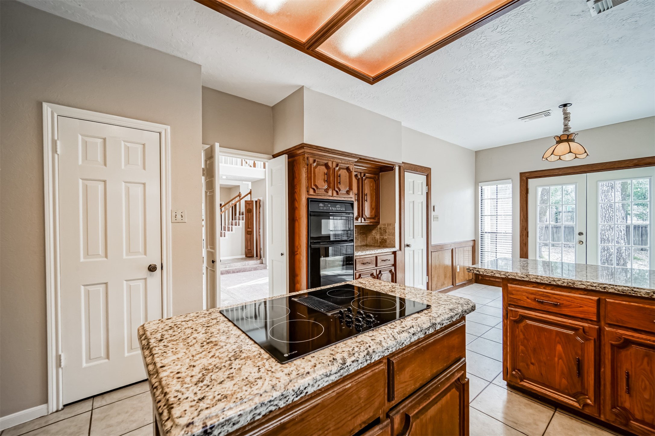 67 North Skyflower Court Spring, TX 77381 - Photo 17 of 45 a kitchen with stainless steel appliances granite countertop a sink stove and cabinets