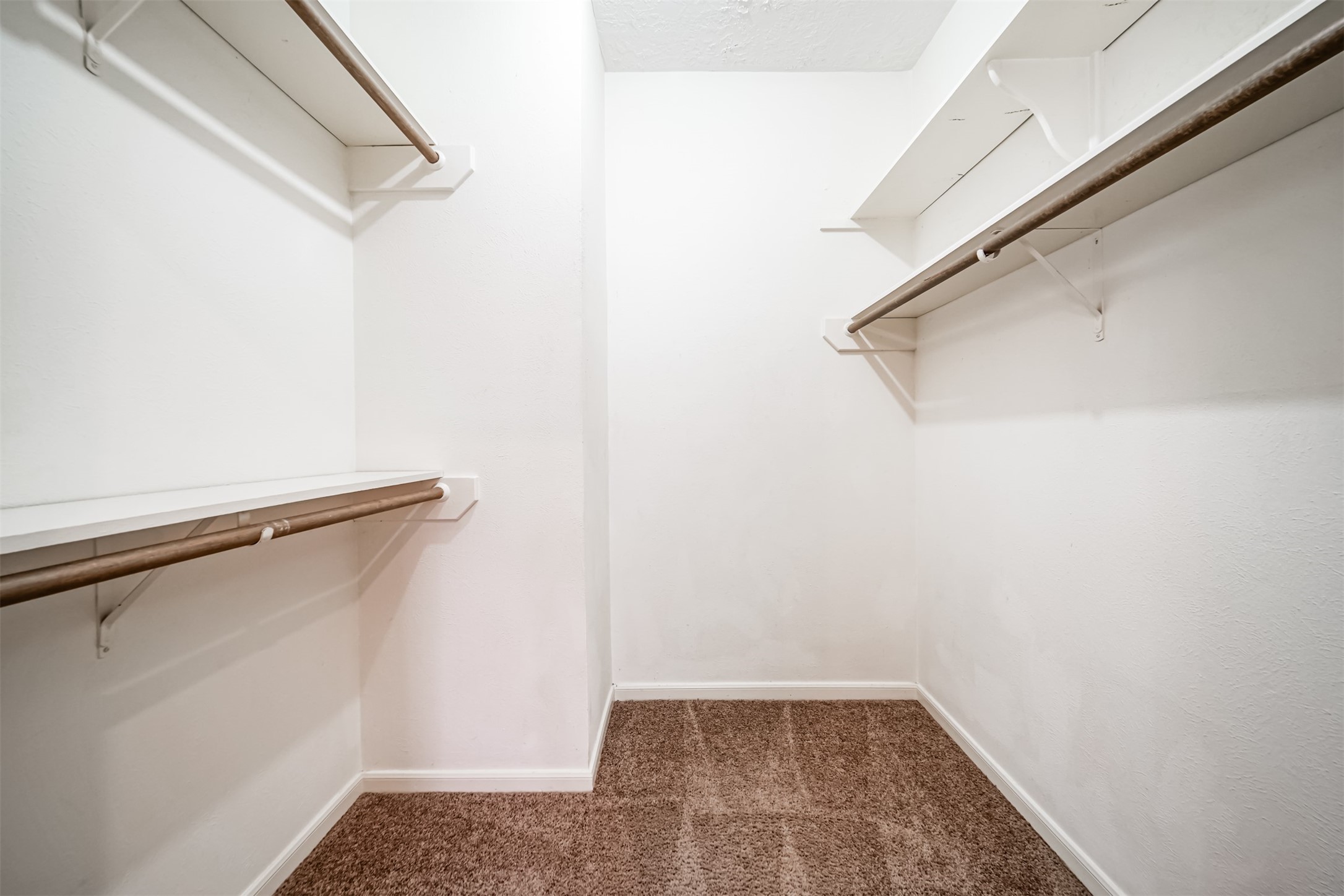 67 North Skyflower Court Spring, TX 77381 - Photo 27 of 45 a view of small space with racks on the wall