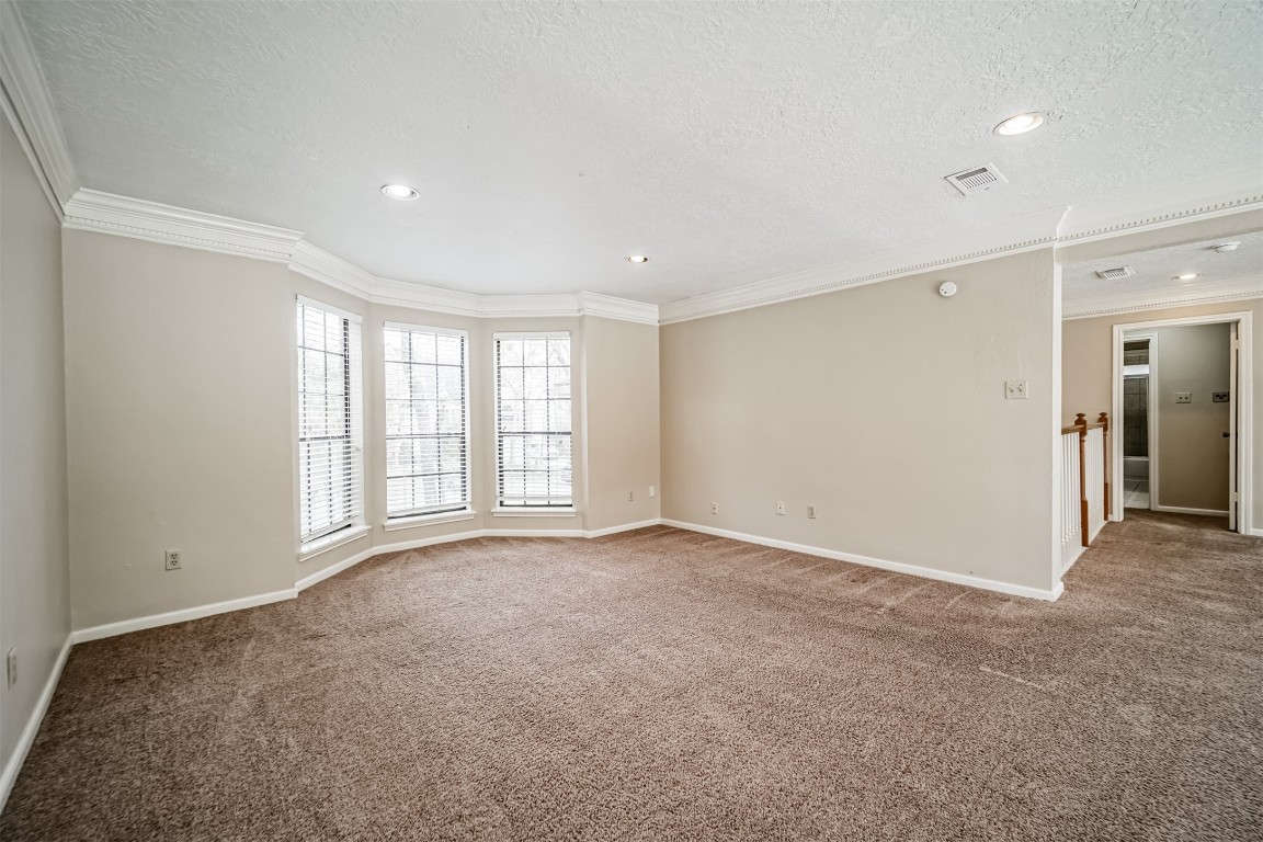 67 North Skyflower Court Spring, TX 77381 - Photo 30 of 45 a view of an empty room with a window