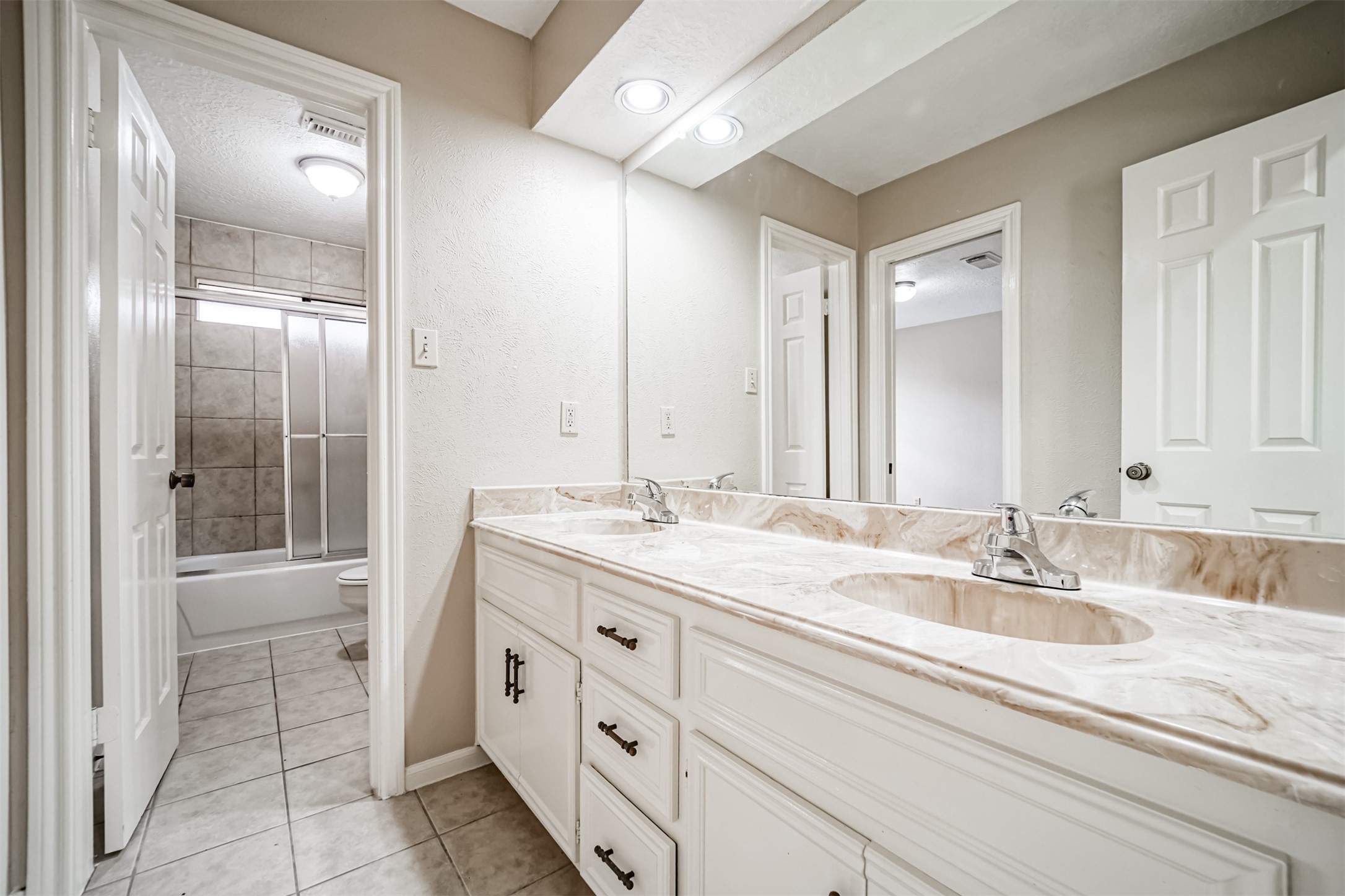 67 North Skyflower Court Spring, TX 77381 - Photo 34 of 45 a bathroom with a granite countertop sink mirror and double