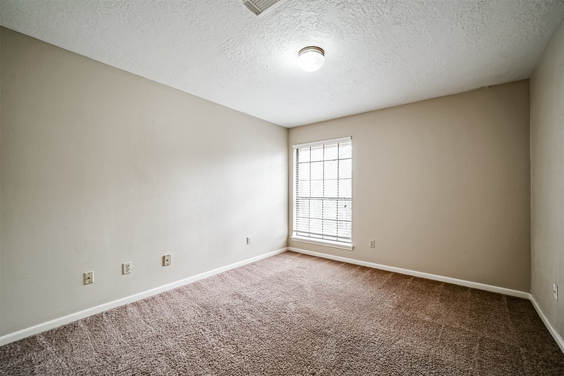 67 North Skyflower Court Spring, TX 77381 - Photo 35 of 45 an empty room with windows and closet