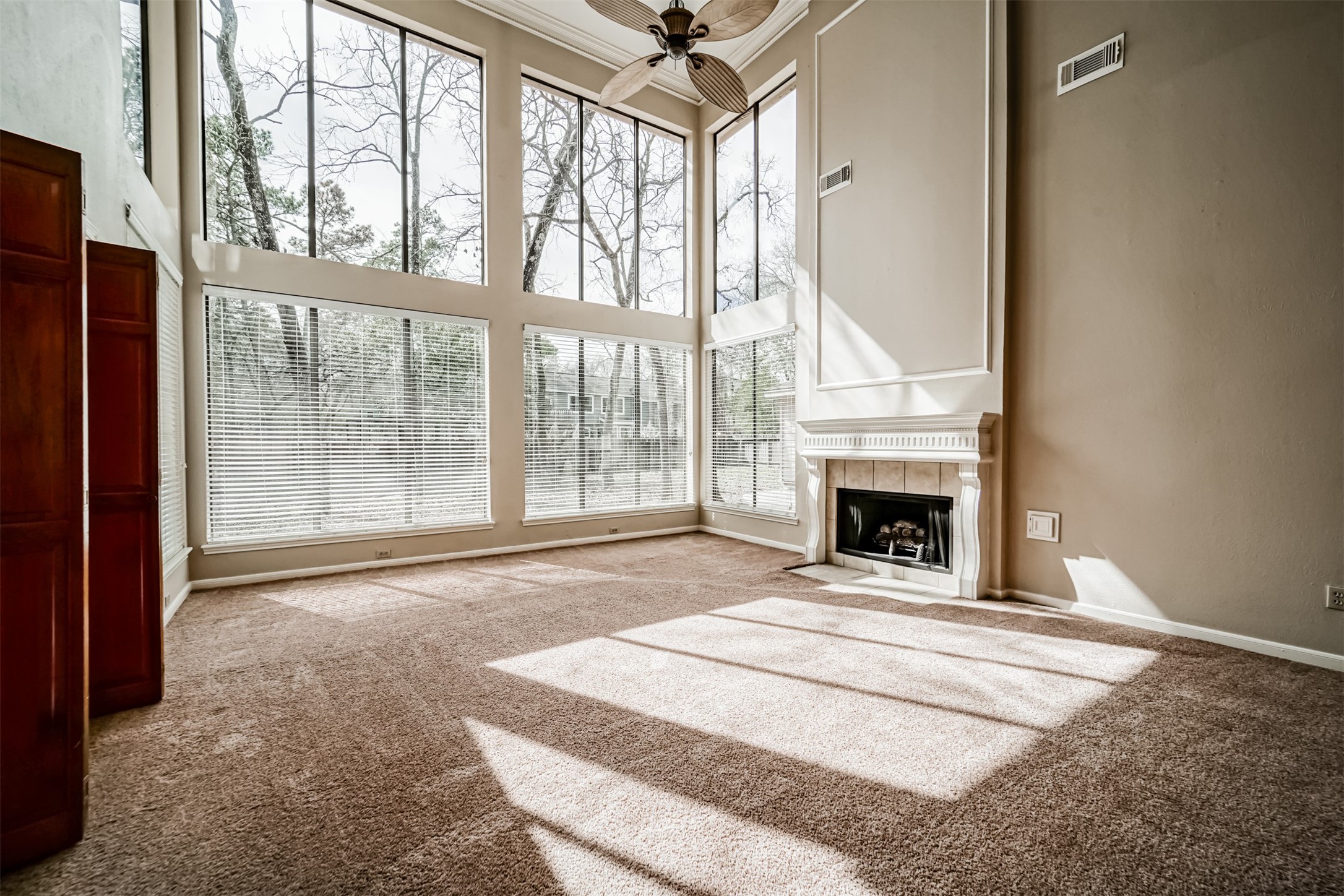67 North Skyflower Court Spring, TX 77381 - Photo 4 of 45 a view of an empty room with a fireplace and a window