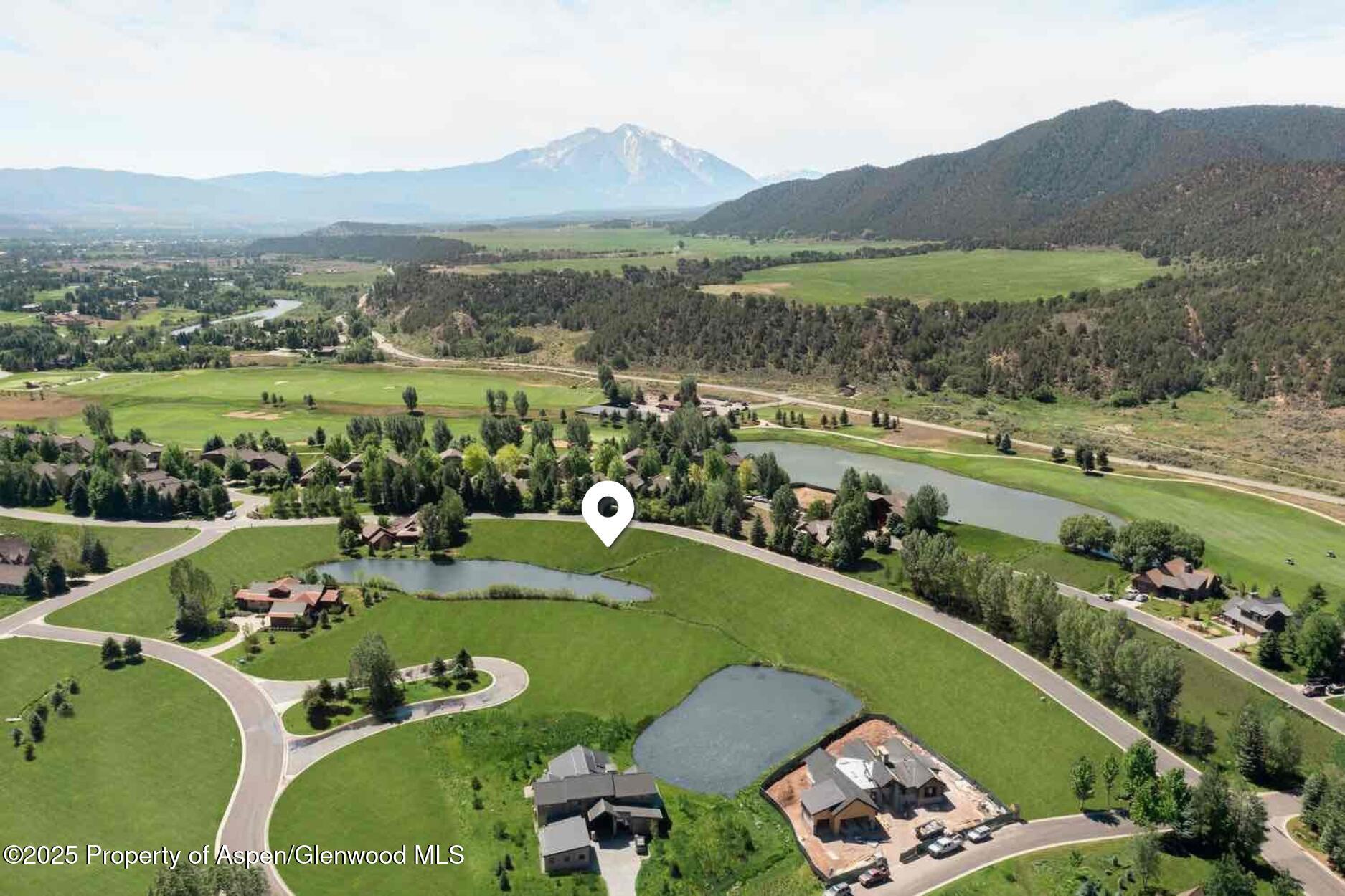 956 Bald Eagle Way Carbondale, CO 81623 - Photo 11 of 13 an aerial view of a house with a garden and lake view