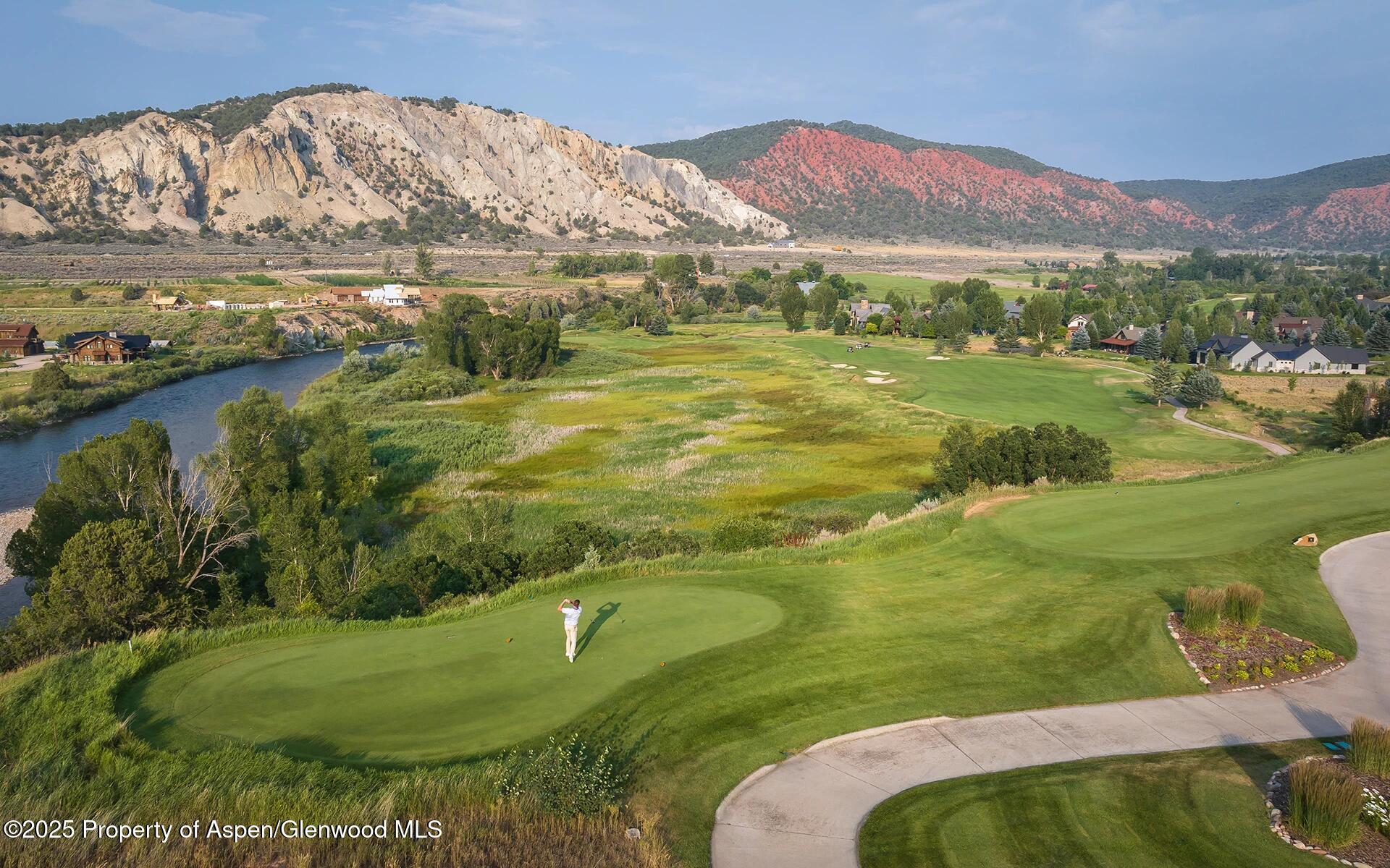 956 Bald Eagle Way Carbondale, CO 81623 - Photo 12 of 13 a view of a lake with a mountain in the background