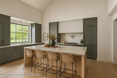 a kitchen with a stove a sink and a refrigerator