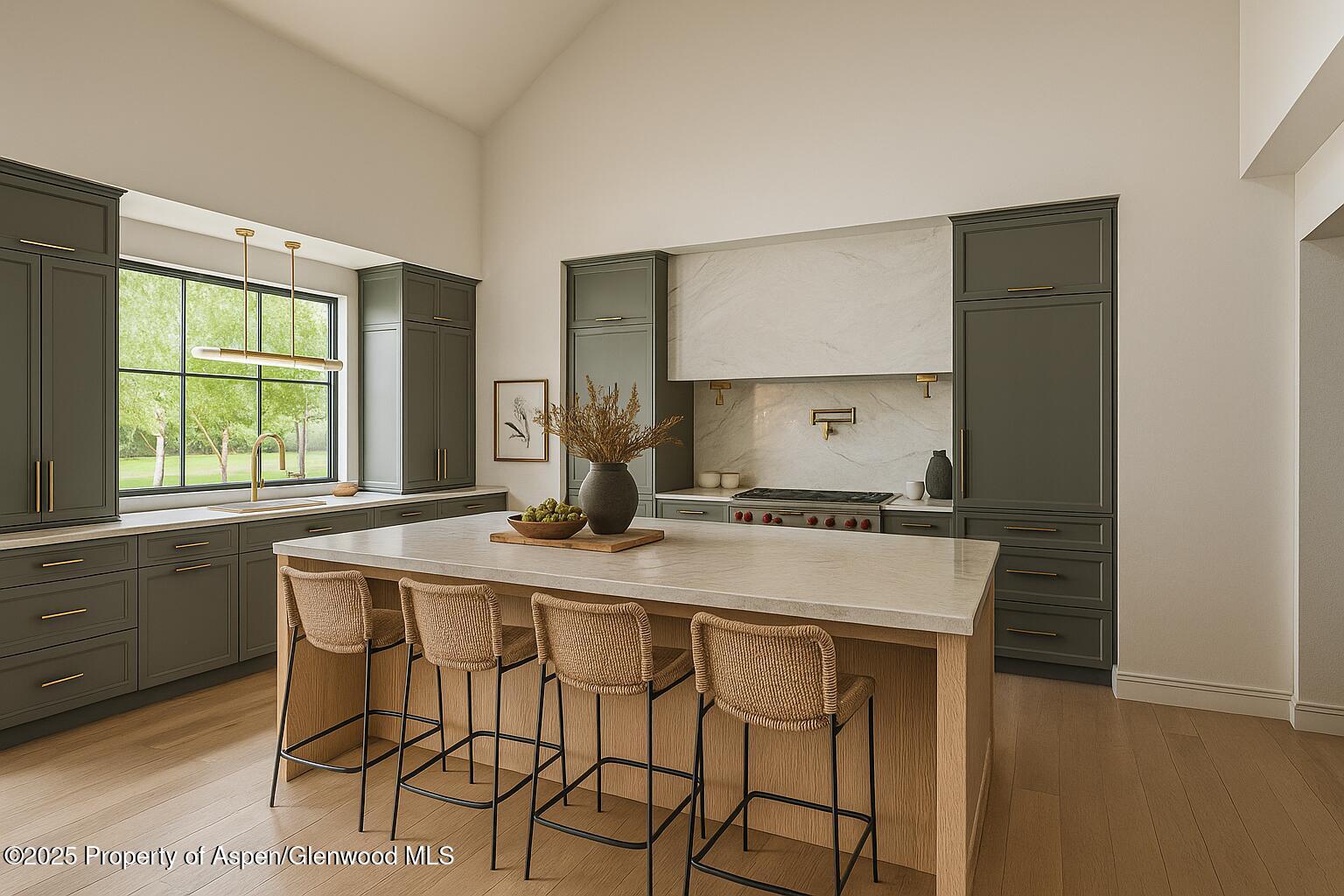 956 Bald Eagle Way Carbondale, CO 81623 - Photo 3 of 13 a kitchen with a stove a sink and a refrigerator