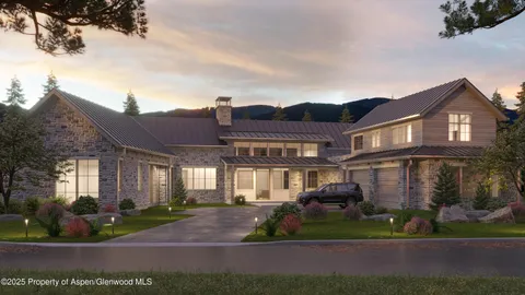 a front view of a house with a garden and trees