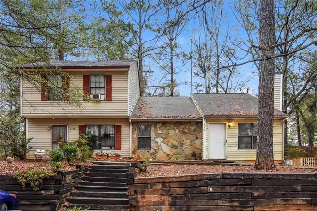 a front view of house with street