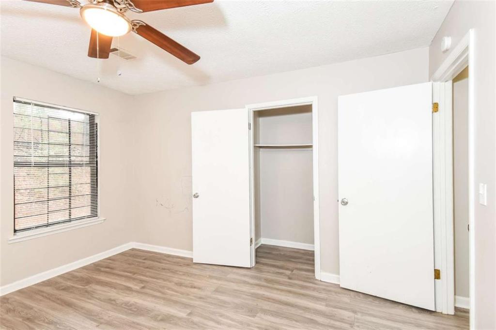 2356 Wingfoot Place Decatur, GA 30035 - Photo 15 of 20 a view of an empty room with wooden floor and a window