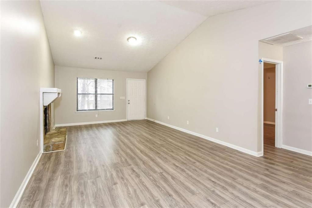 2356 Wingfoot Place Decatur, GA 30035 - Photo 3 of 20 wooden floor in an empty room with a window