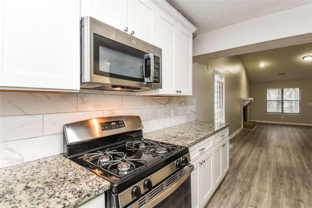 2356 Wingfoot Place Decatur, GA 30035 - Photo 7 of 20 a kitchen with a stove and a microwave