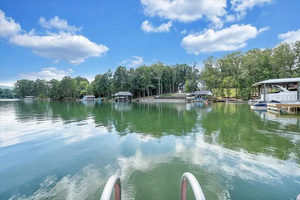 a view of a lake in front of a house