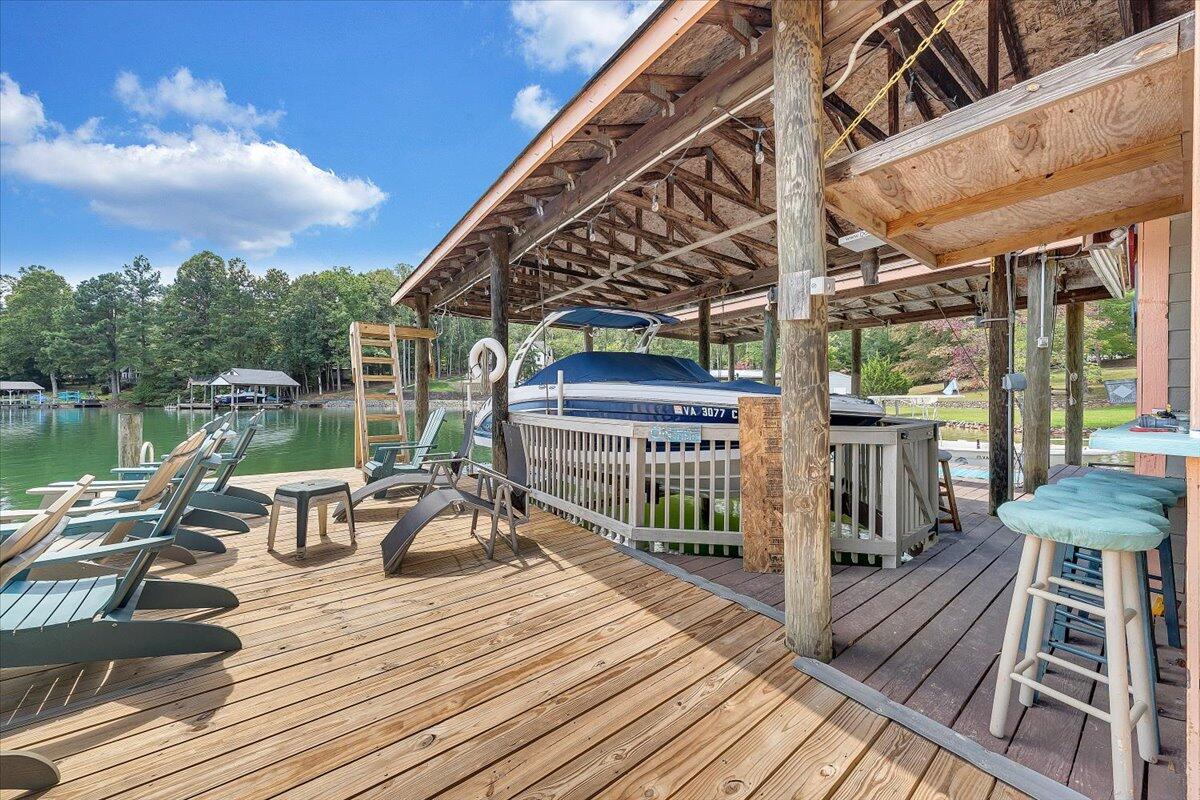 2544 Patmos Church Road Huddleston, VA 24104 - Photo 26 of 33 a view of a balcony with two chairs and wooden floor