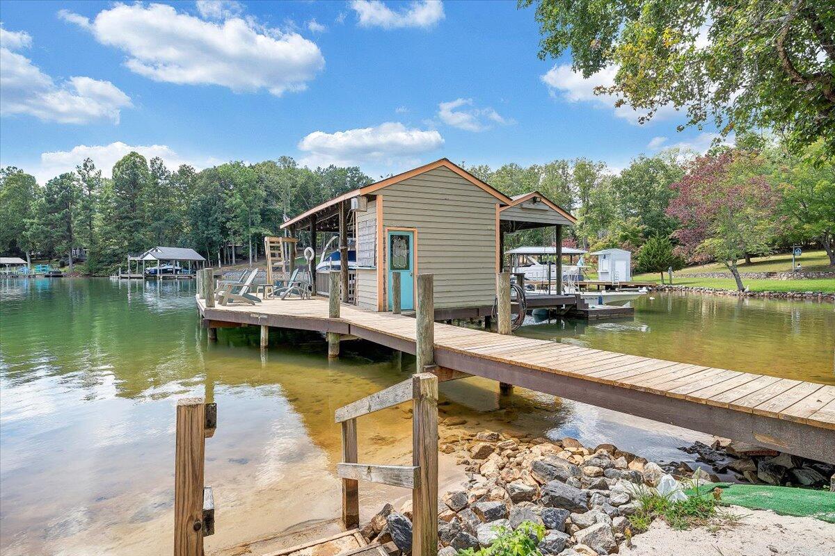 2544 Patmos Church Road Huddleston, VA 24104 - Photo 28 of 33 a view of a house with pool and chairs next to a yard
