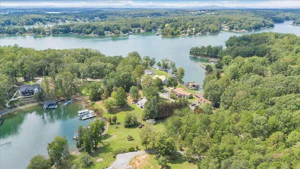 an aerial view of a houses with lake view
