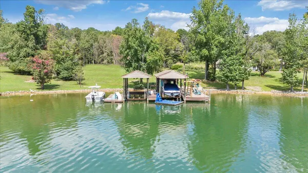 a swimming pool view with a lake view