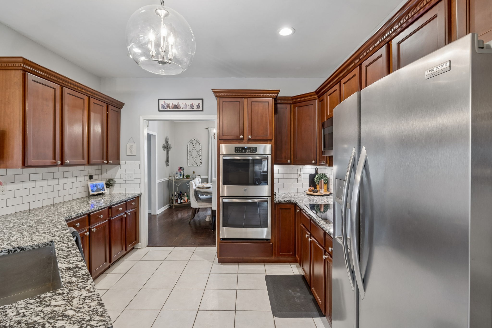 119 Christi Place Pleasant View, TN 37146 - Photo 13 of 62 a kitchen with stainless steel appliances granite countertop a refrigerator and a stove top oven
