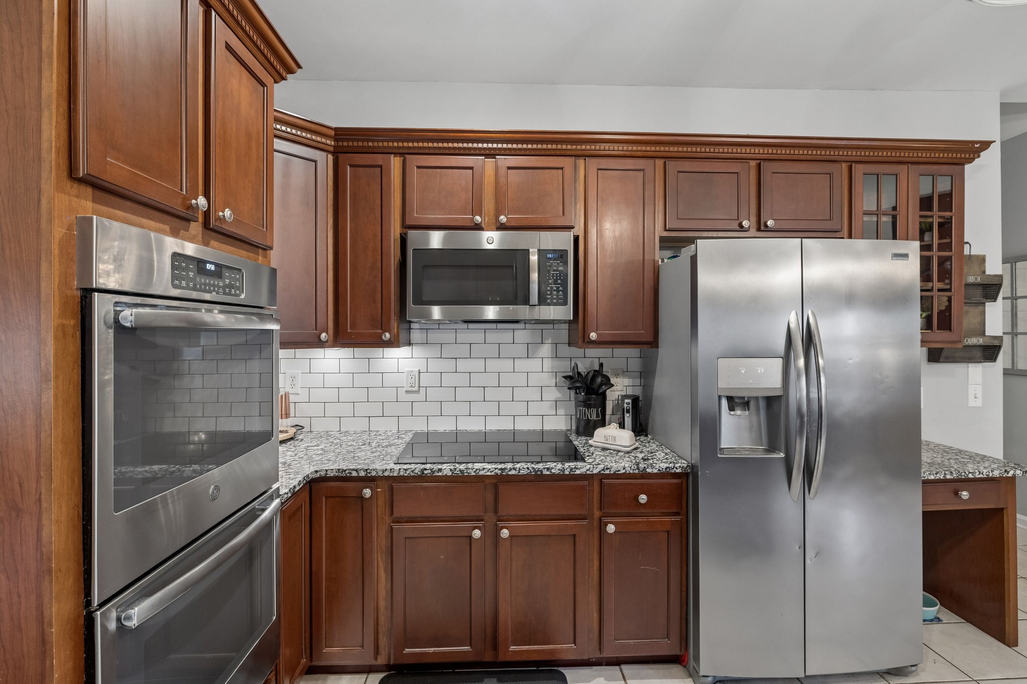 119 Christi Place Pleasant View, TN 37146 - Photo 16 of 62 a kitchen with stainless steel appliances granite countertop a refrigerator and a sink