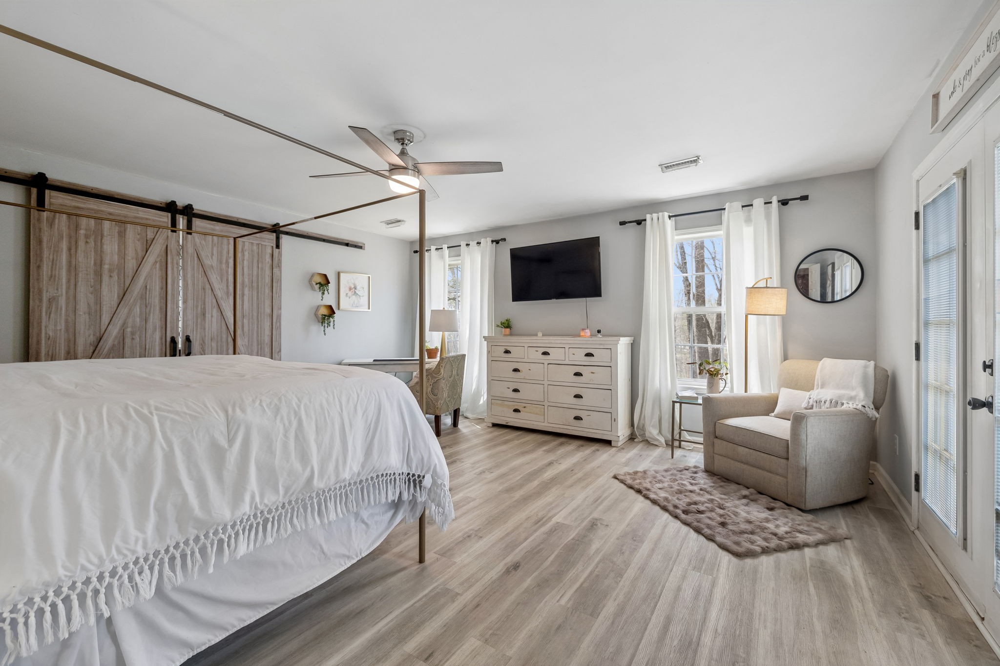 119 Christi Place Pleasant View, TN 37146 - Photo 20 of 62 a spacious bedroom with a bed a couch and a flat screen tv