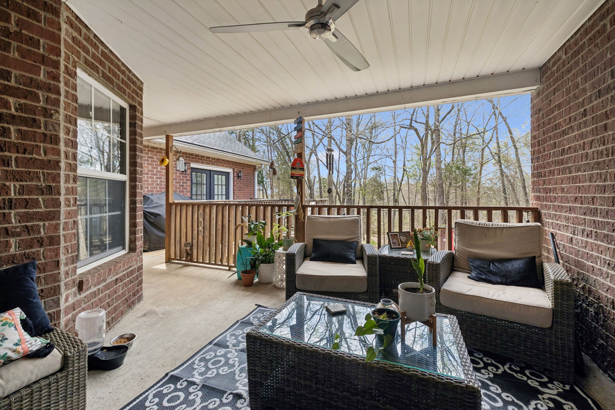 119 Christi Place Pleasant View, TN 37146 - Photo 29 of 62 a living room with furniture and a floor to ceiling window