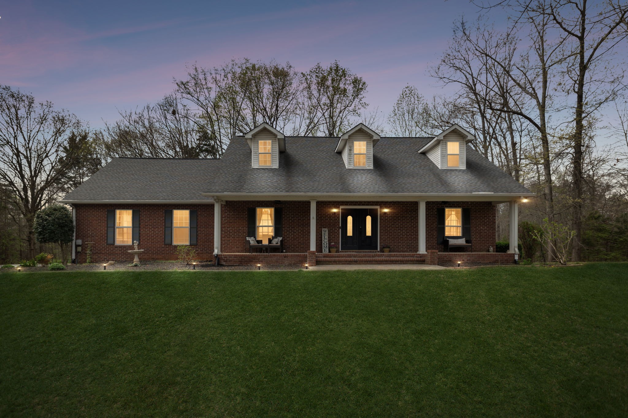 119 Christi Place Pleasant View, TN 37146 - Photo 4 of 62 a front view of house with a garden