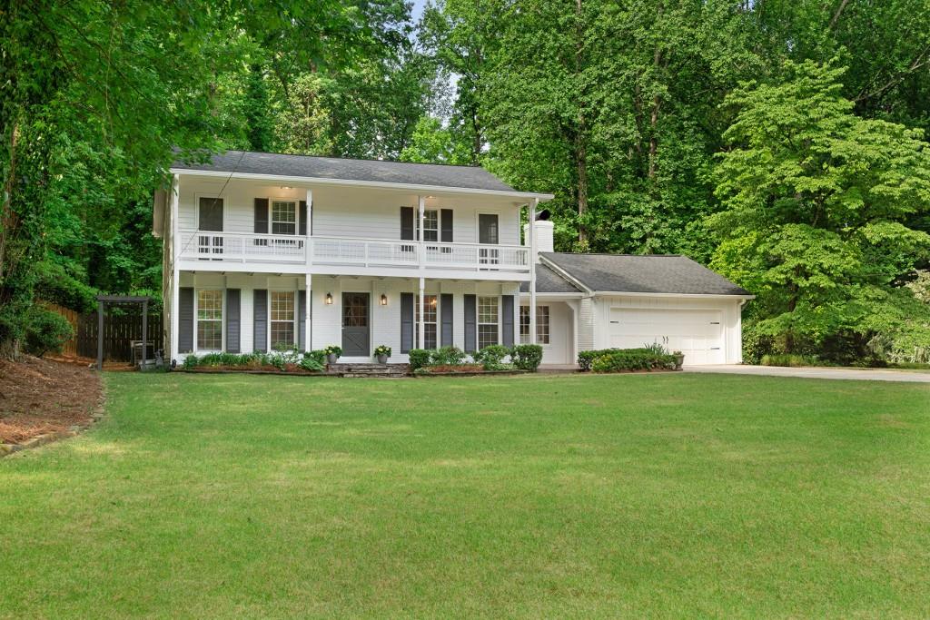 front view of a house with a garden
