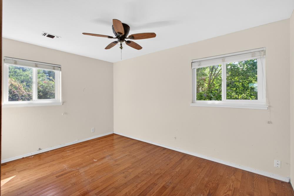 8780 Elm Avenue Orangevale, CA 95662 - Photo 12 of 23 a view of empty room with wooden floor and fan