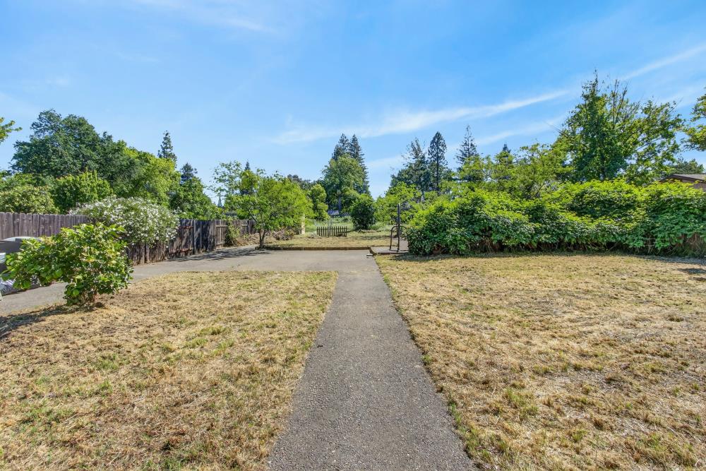 8780 Elm Avenue Orangevale, CA 95662 - Photo 15 of 23 a view of a pathway with a yard