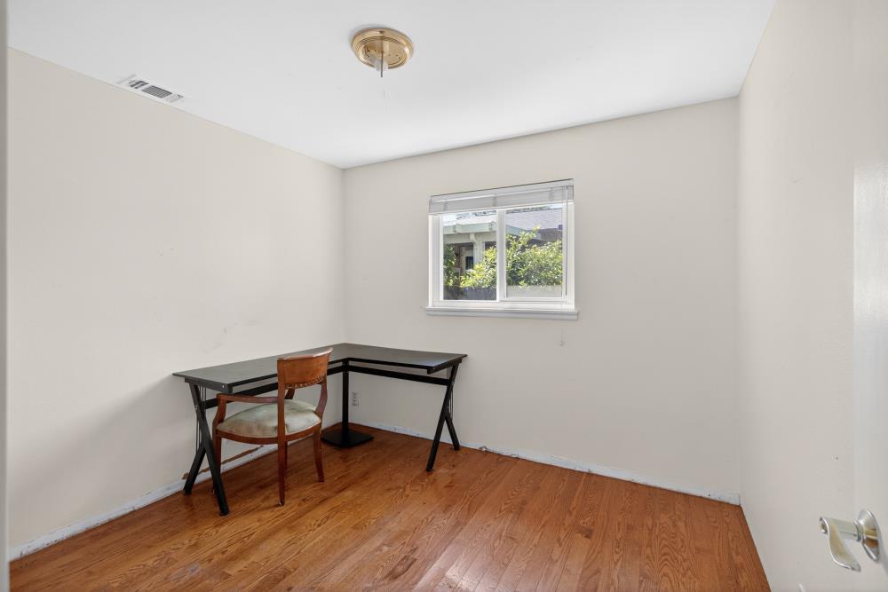 8780 Elm Avenue Orangevale, CA 95662 - Photo 9 of 23 a view of a room with wooden floor and a window
