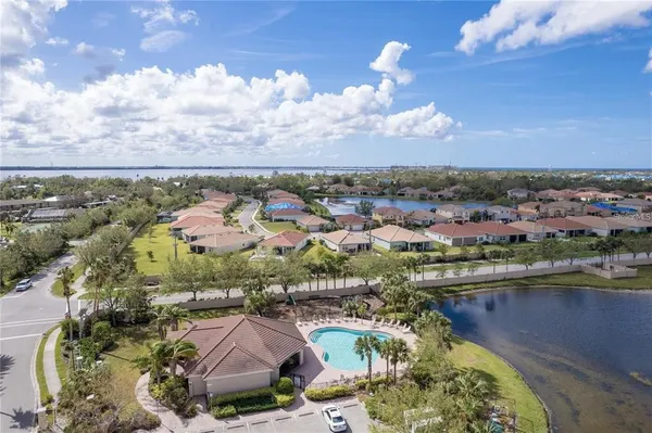an aerial view of residential houses with outdoor space